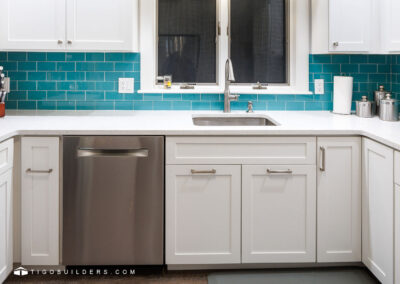 Dishwasher installed to the left of the sink.